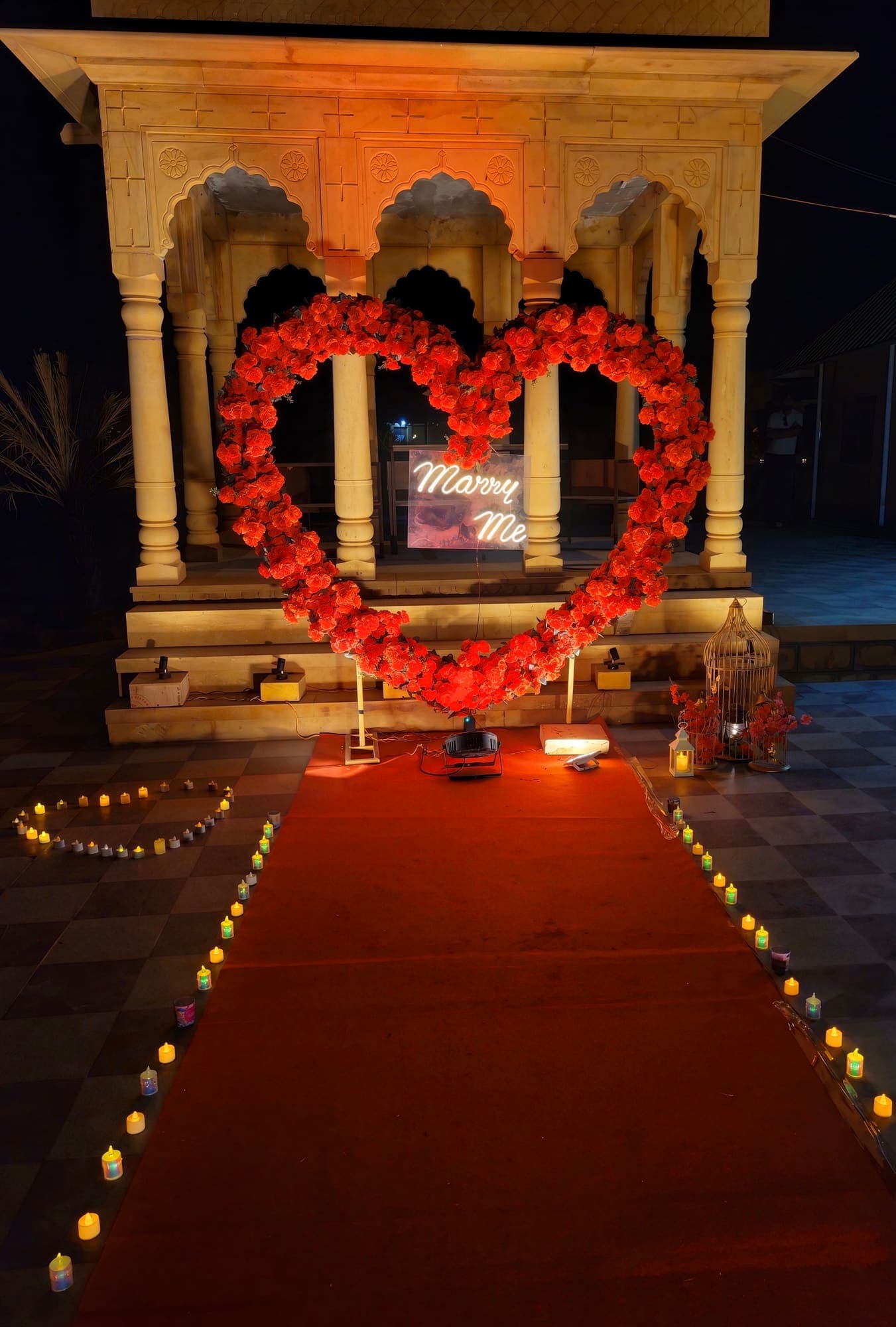 A heart of flowers, lit by diyas